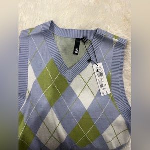 A women’s XS argyle garage vest